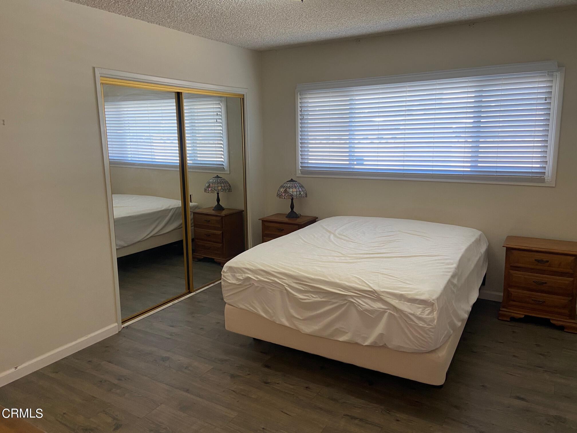 3611 South E Street Oxnard, CA 93033 - Photo 6 of 14 a bedroom with a bed and a window