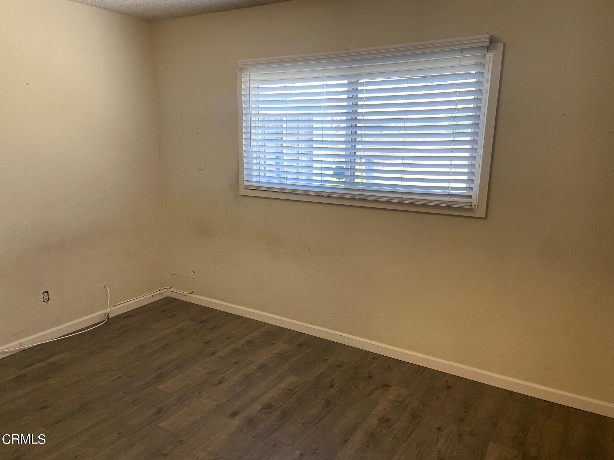 3611 South E Street Oxnard, CA 93033 - Photo 7 of 14 an empty room with a window