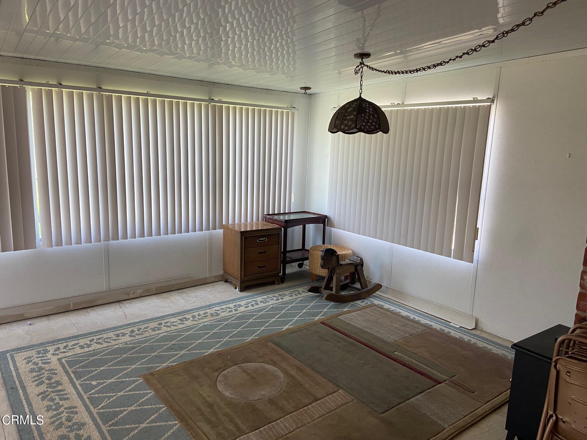 3611 South E Street Oxnard, CA 93033 - Photo 10 of 14 a bedroom with a bed and a window