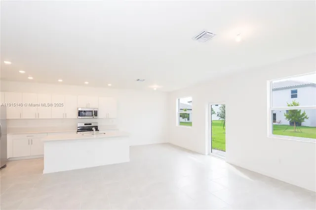 a view of a kitchen with a sink