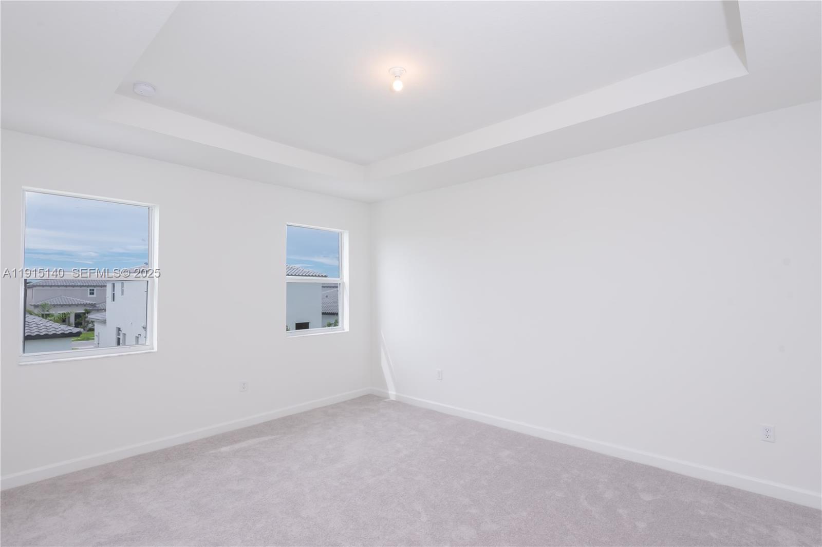 2636 Southeast 8th Court Homestead, FL 33035 - Photo 25 of 49 an empty room with windows