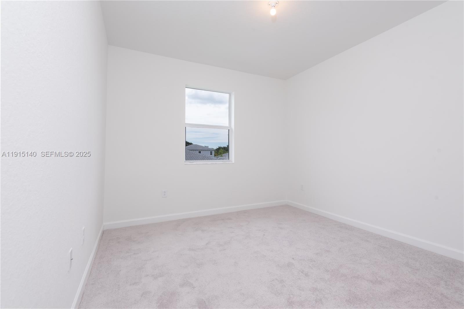 2636 Southeast 8th Court Homestead, FL 33035 - Photo 39 of 49 an empty room with a window