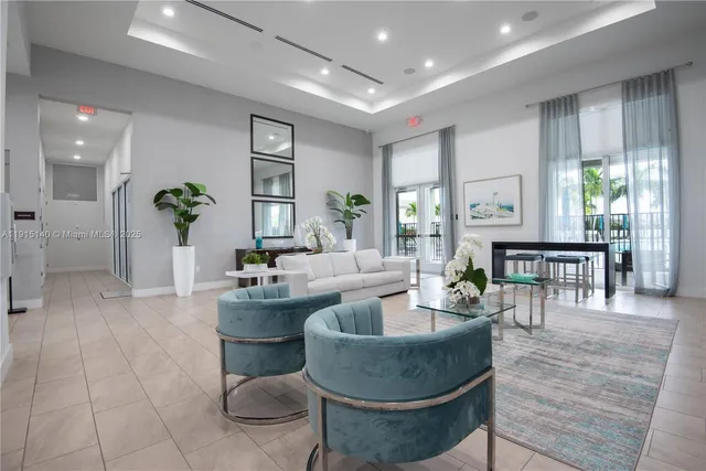 a living room with furniture wooden floor and a potted plant