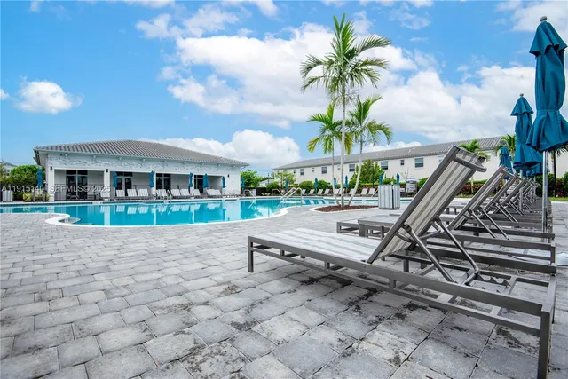 a view of a lake with a house in the background