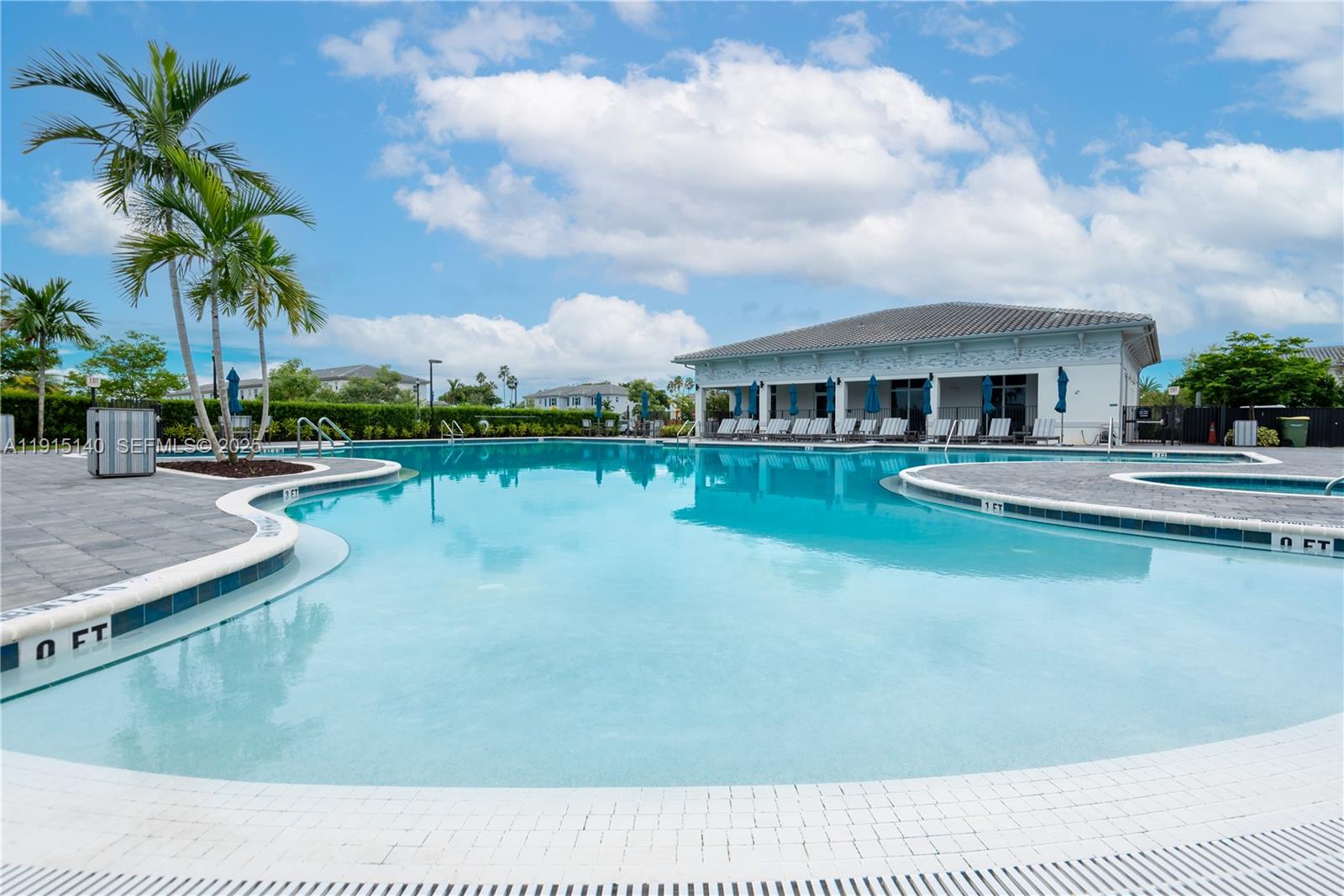 2636 Southeast 8th Court Homestead, FL 33035 - Photo 48 of 49 a view of a lake with a house in the background