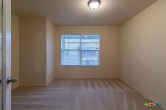 a view of a room with an empty space