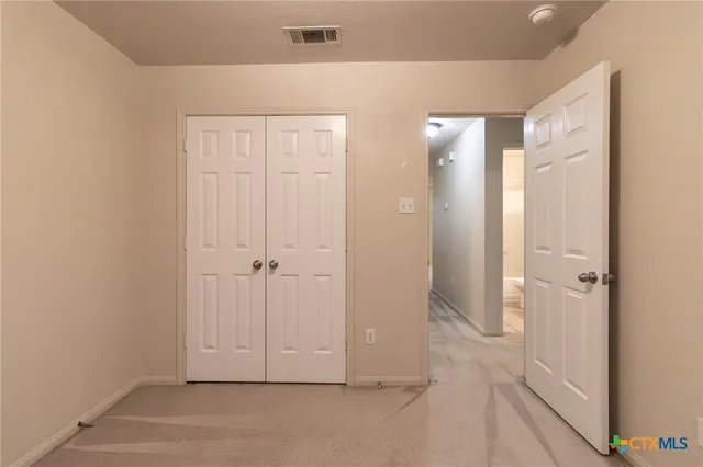 a view of empty room with windows