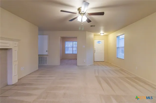 a view of an empty room with a bathroom