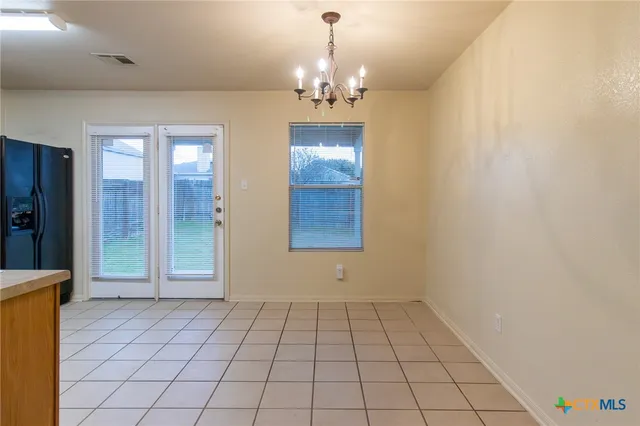 a view of an empty room and window