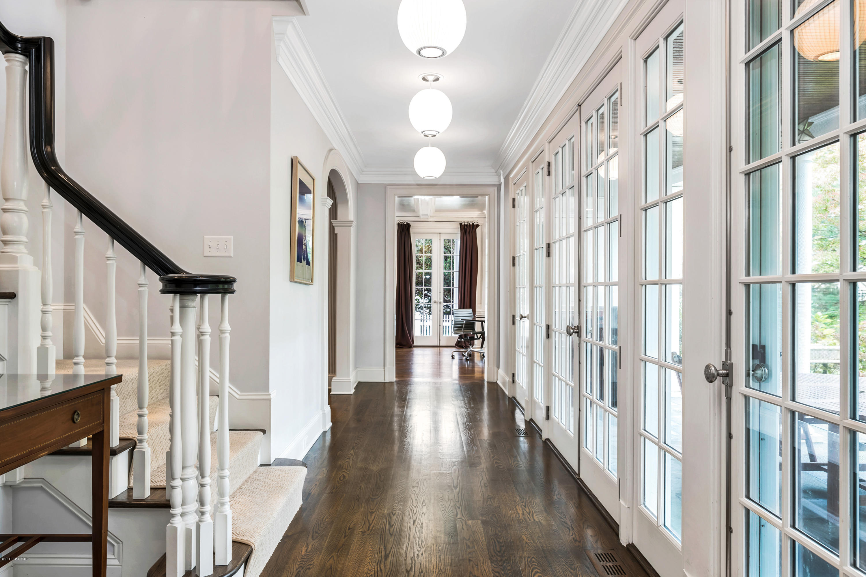 19 Willow Road Riverside, CT 06878 - Photo 8 of 31 a view of a hallway with wooden floor and staircase