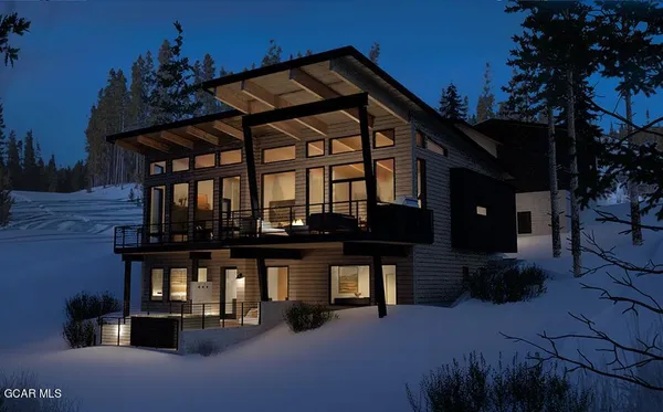 a view of house with outdoor space and sitting area