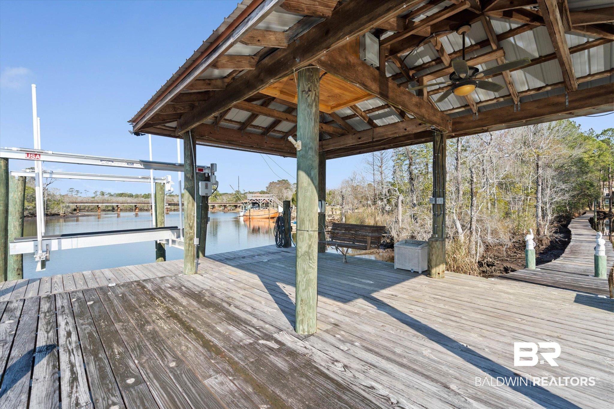 3847 Riviere Du Chien Road Mobile, AL 36693 - Photo 26 of 51 Dock area featuring boat lift and a water view