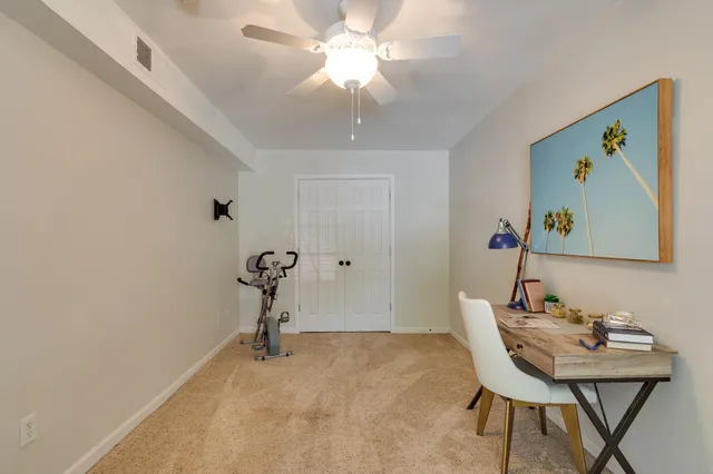 a view of a workspace with furniture