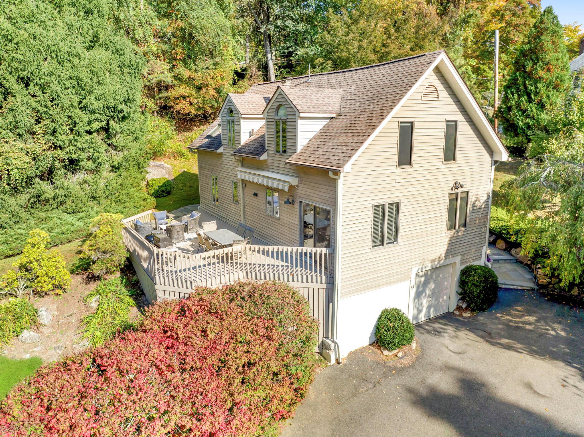 a view of a couches in the patio with potted plants