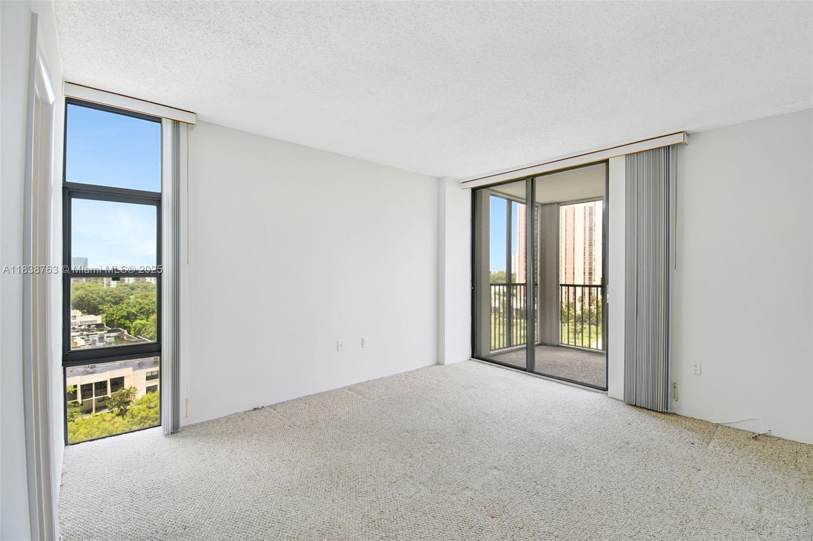 20100 West Country Club Drive, Unit 1005 Aventura, FL 33180 - Photo 14 of 36 a view of an empty room with a window