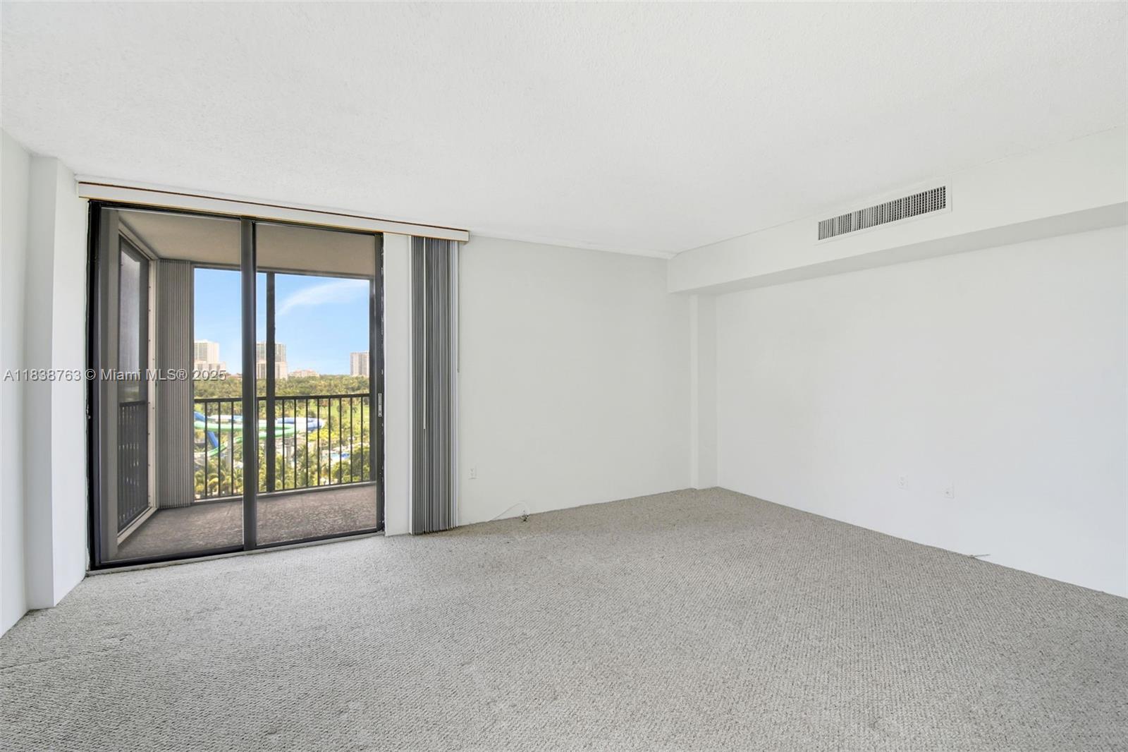 20100 West Country Club Drive, Unit 1005 Aventura, FL 33180 - Photo 16 of 36 an empty room with windows