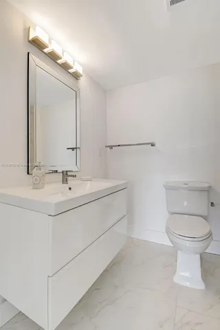 a bathroom with a sink and a toilet
