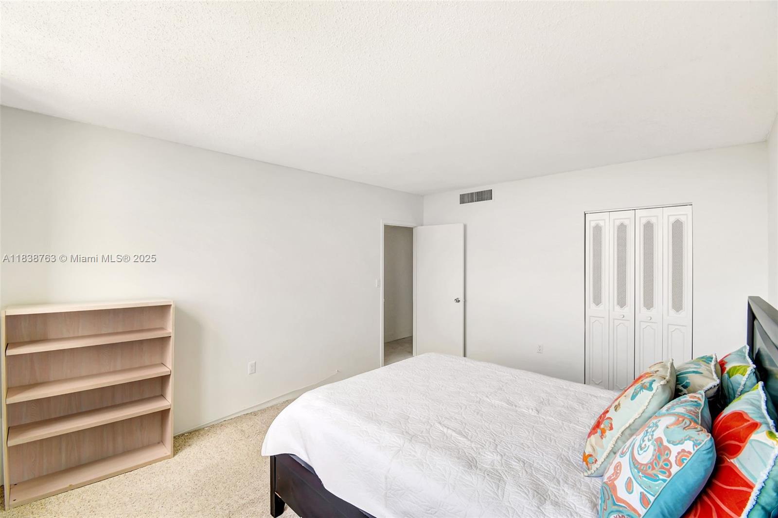 20100 West Country Club Drive, Unit 1005 Aventura, FL 33180 - Photo 21 of 36 a bedroom with a bed and a window