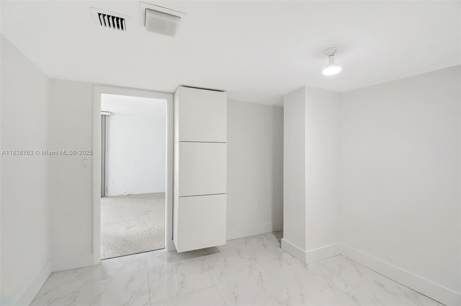 20100 West Country Club Drive, Unit 1005 Aventura, FL 33180 - Photo 24 of 36 a view of an empty room