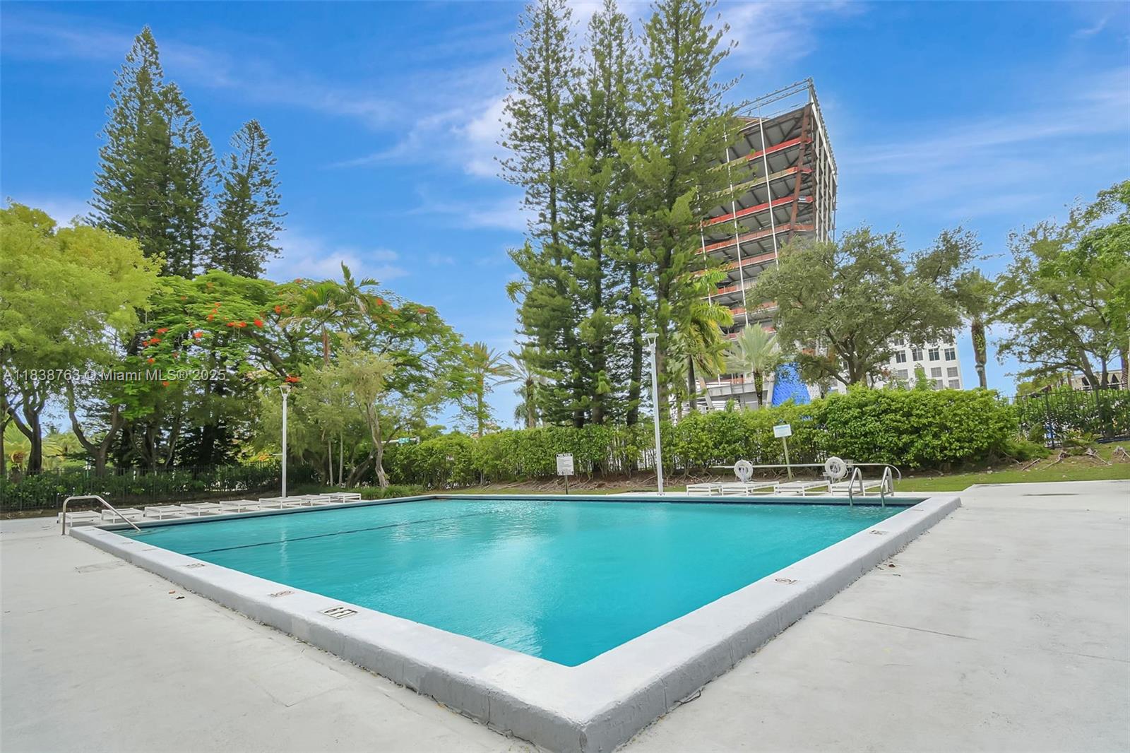 20100 West Country Club Drive, Unit 1005 Aventura, FL 33180 - Photo 31 of 36 a view of a swimming pool and a yard