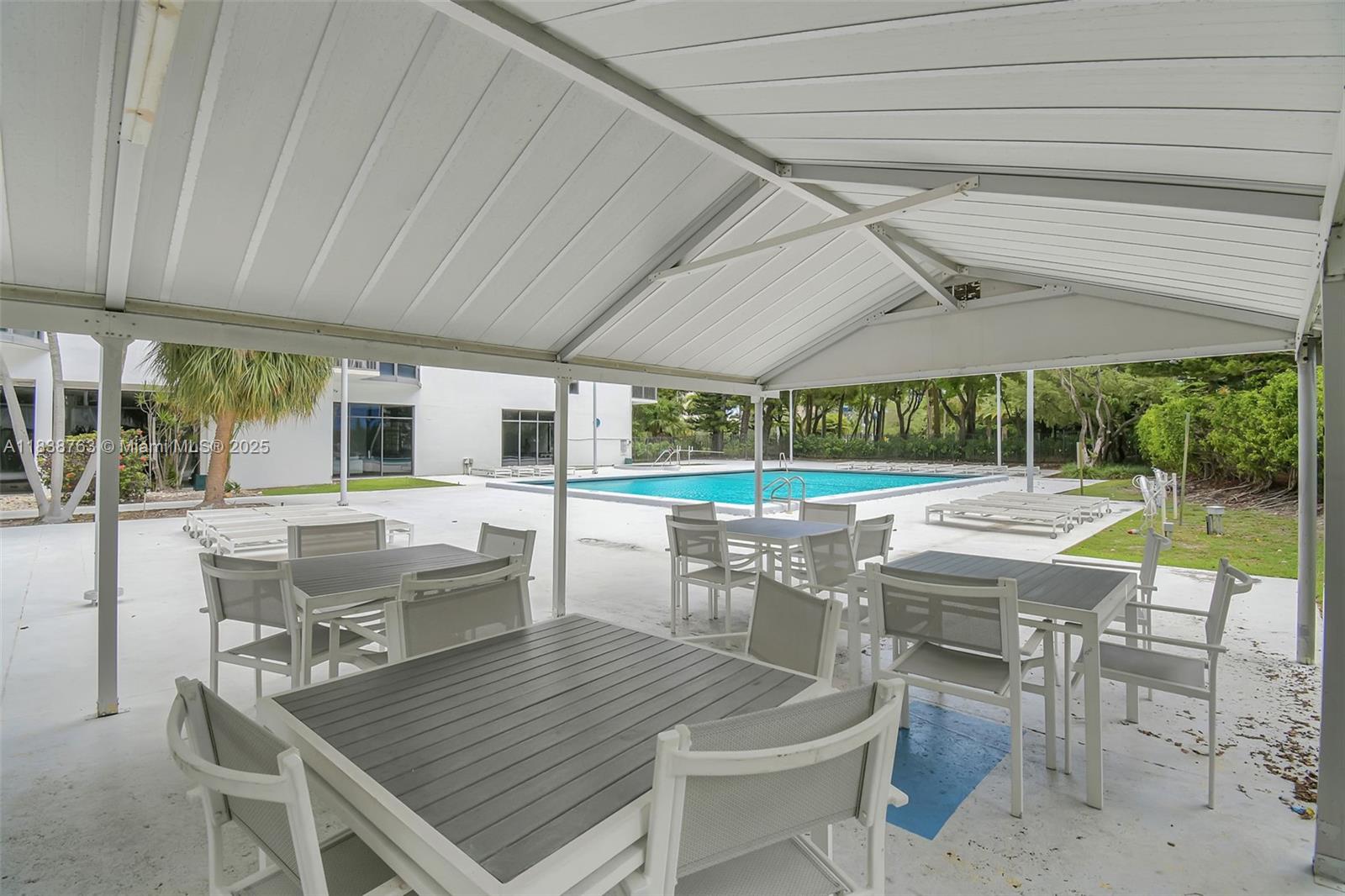 20100 West Country Club Drive, Unit 1005 Aventura, FL 33180 - Photo 33 of 36 an outdoor space with patio lots of furniture