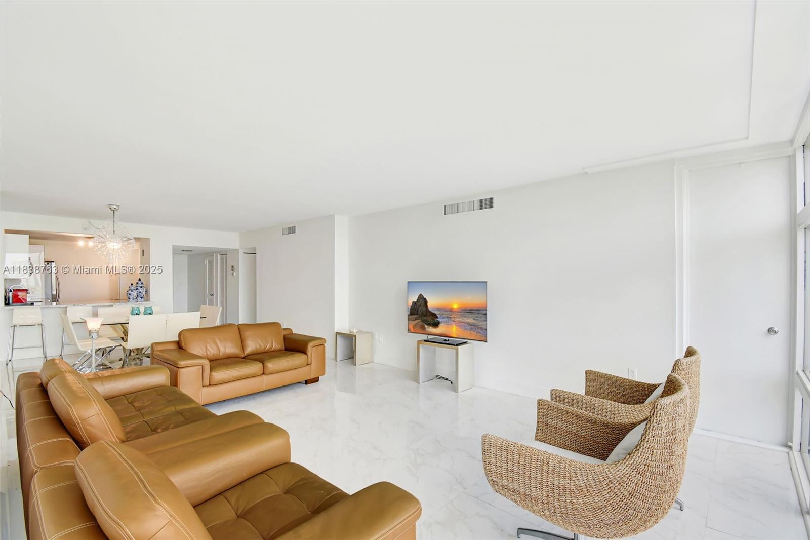 20100 West Country Club Drive, Unit 1005 Aventura, FL 33180 - Photo 4 of 36 a living room with furniture and a couch