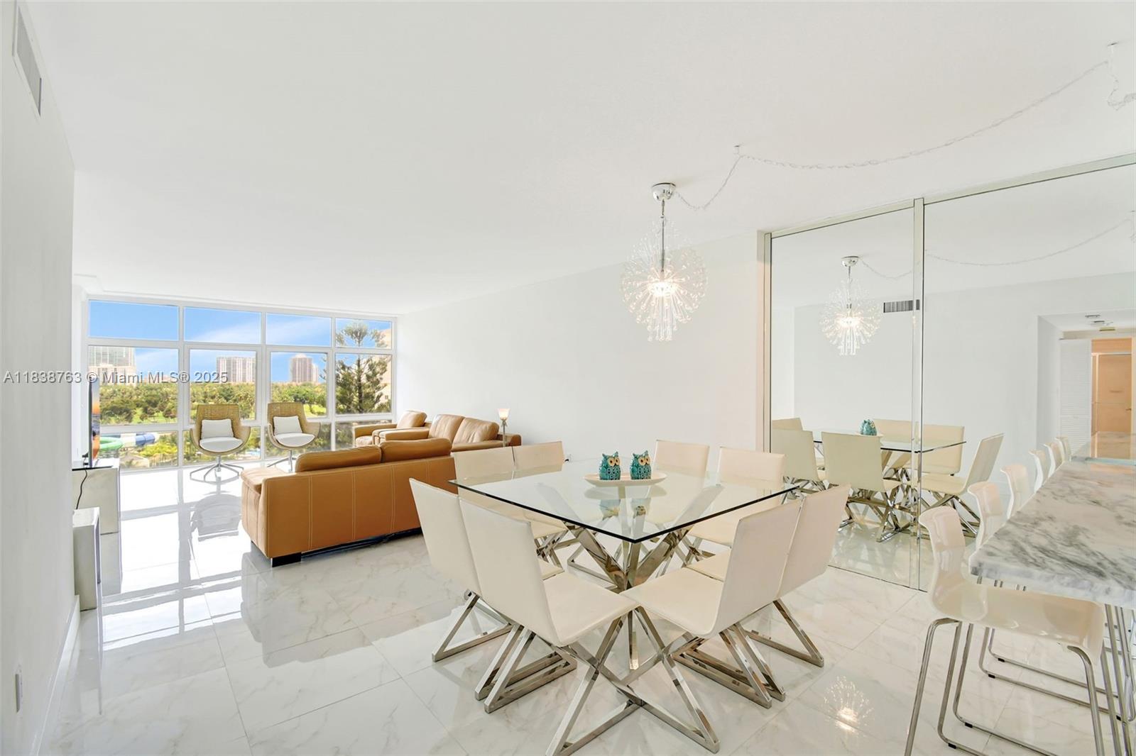 20100 West Country Club Drive, Unit 1005 Aventura, FL 33180 - Photo 5 of 36 a living room with furniture and a large window