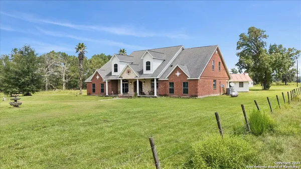 a view of a house with a big yard
