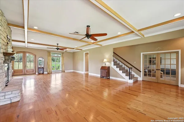 a view of an entryway with wooden floor