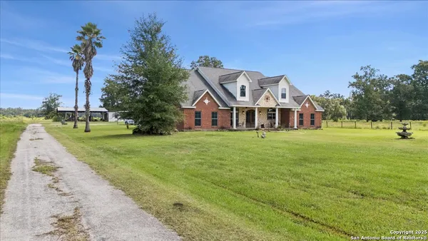 a front view of a house with a yard