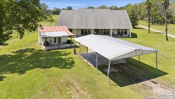 an aerial view of a house with swimming pool