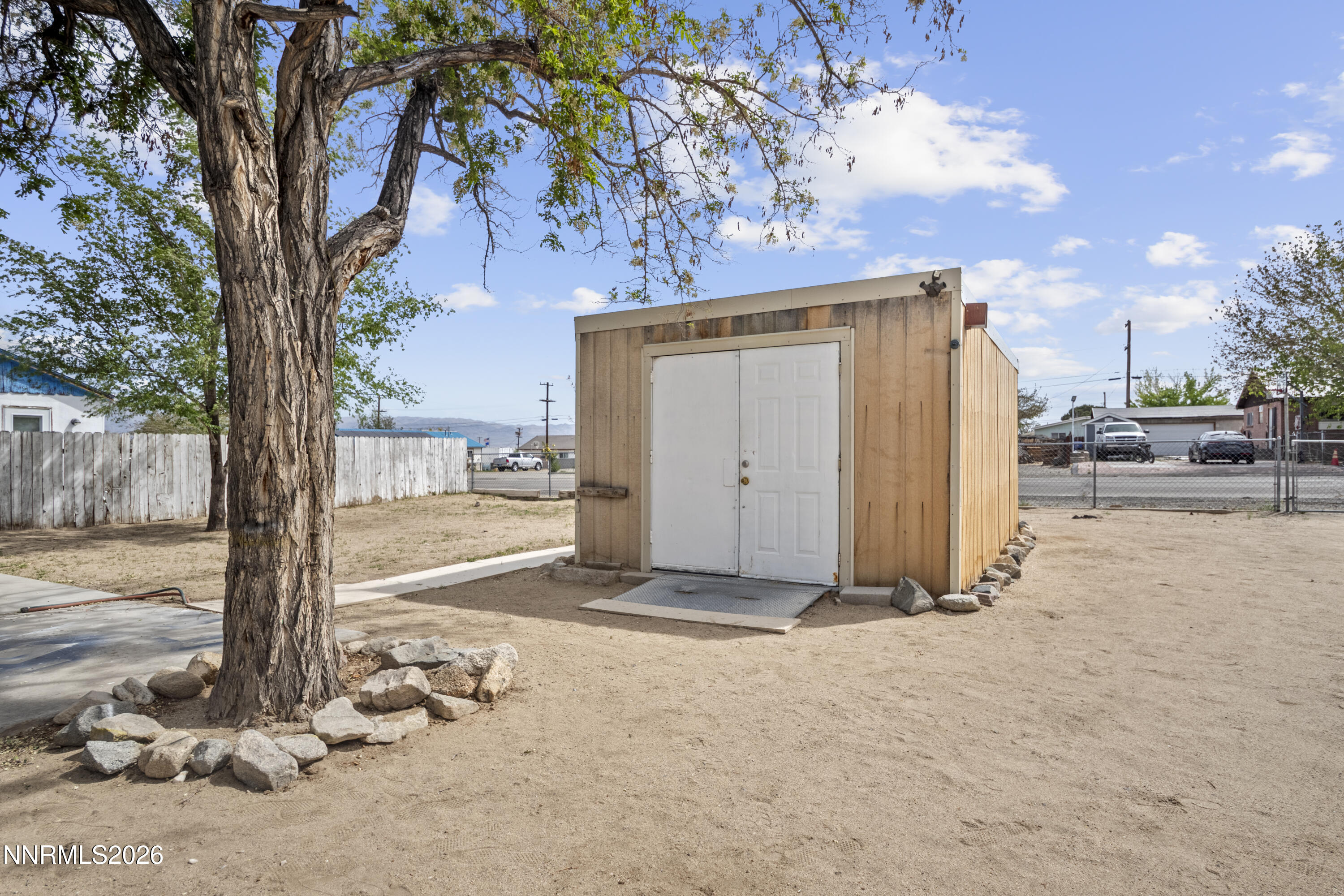 885 I Street Hawthorne, NV 89415 - Photo 16 of 20 a view of a house with backyard and a tree