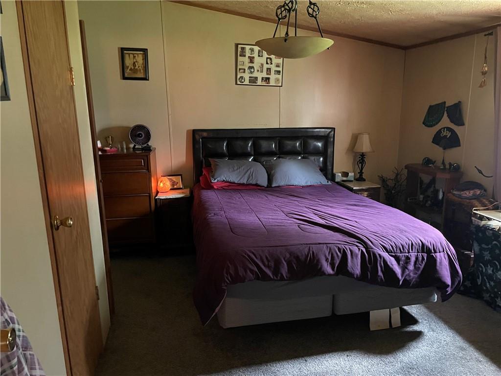 45-47 Ray Road Greenville, PA 16125 - Photo 14 of 15 a bed sitting in a bedroom next to a window