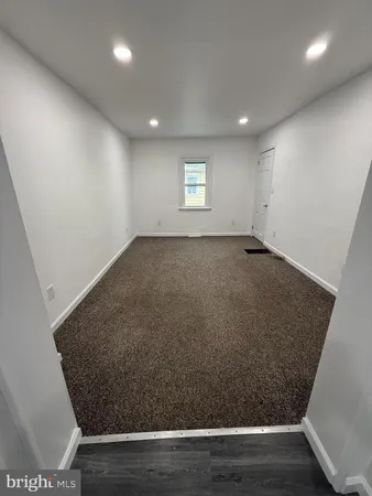 an empty room with wooden floor