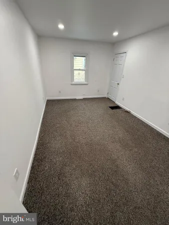 an empty room with a empty space and window