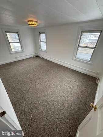 en empty room with windows