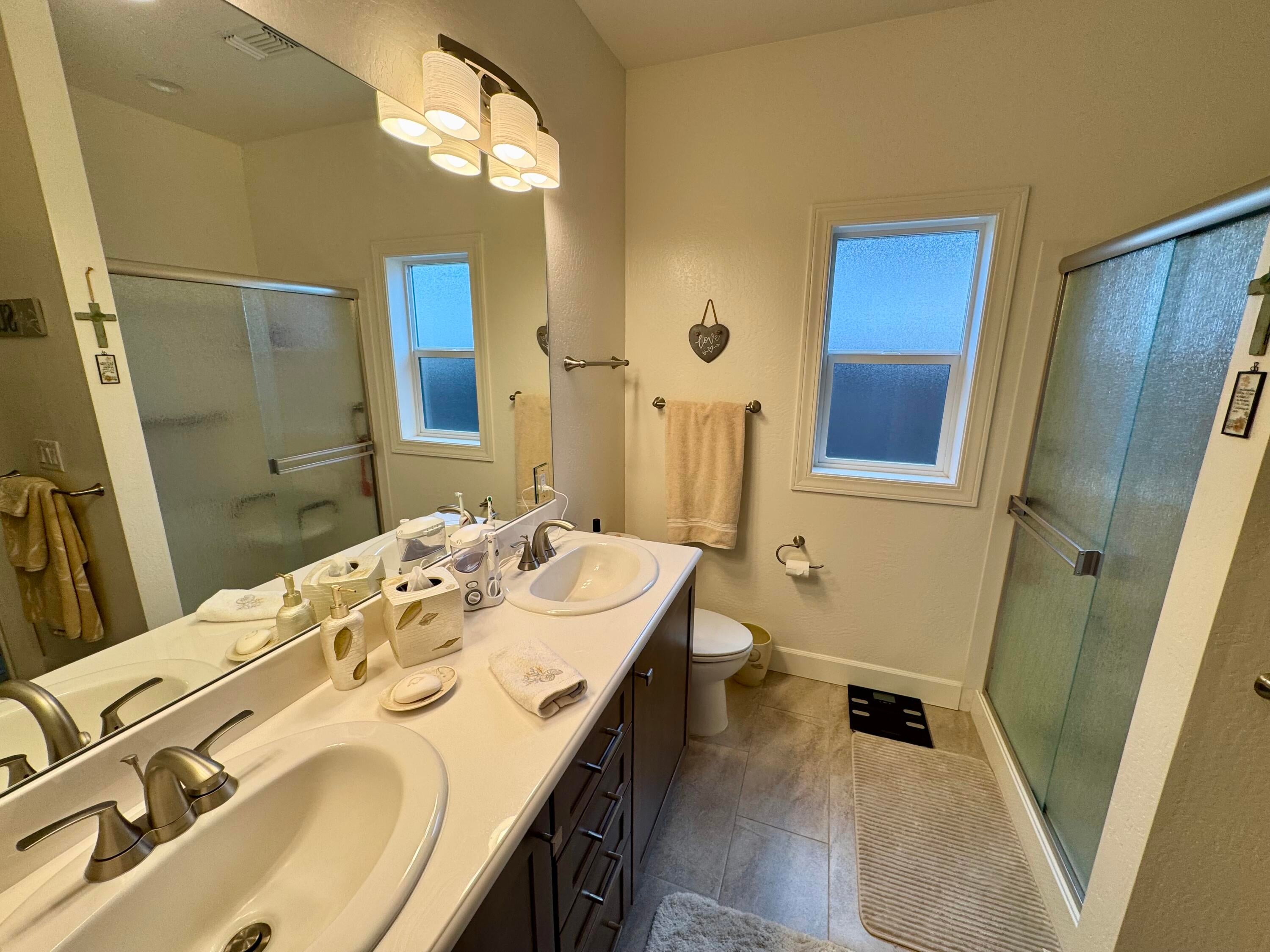 438 Cheney Loop Central Point, OR 97502 - Photo 10 of 15 Primary bathroom; dual sinks, large shower, walk-in closet