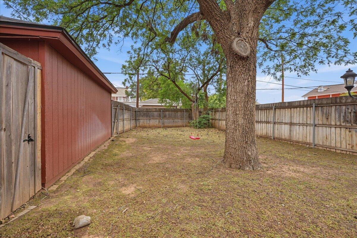 2702 20th Street Lubbock, TX 79410 - Photo 29 of 34 a view of backyard and tree