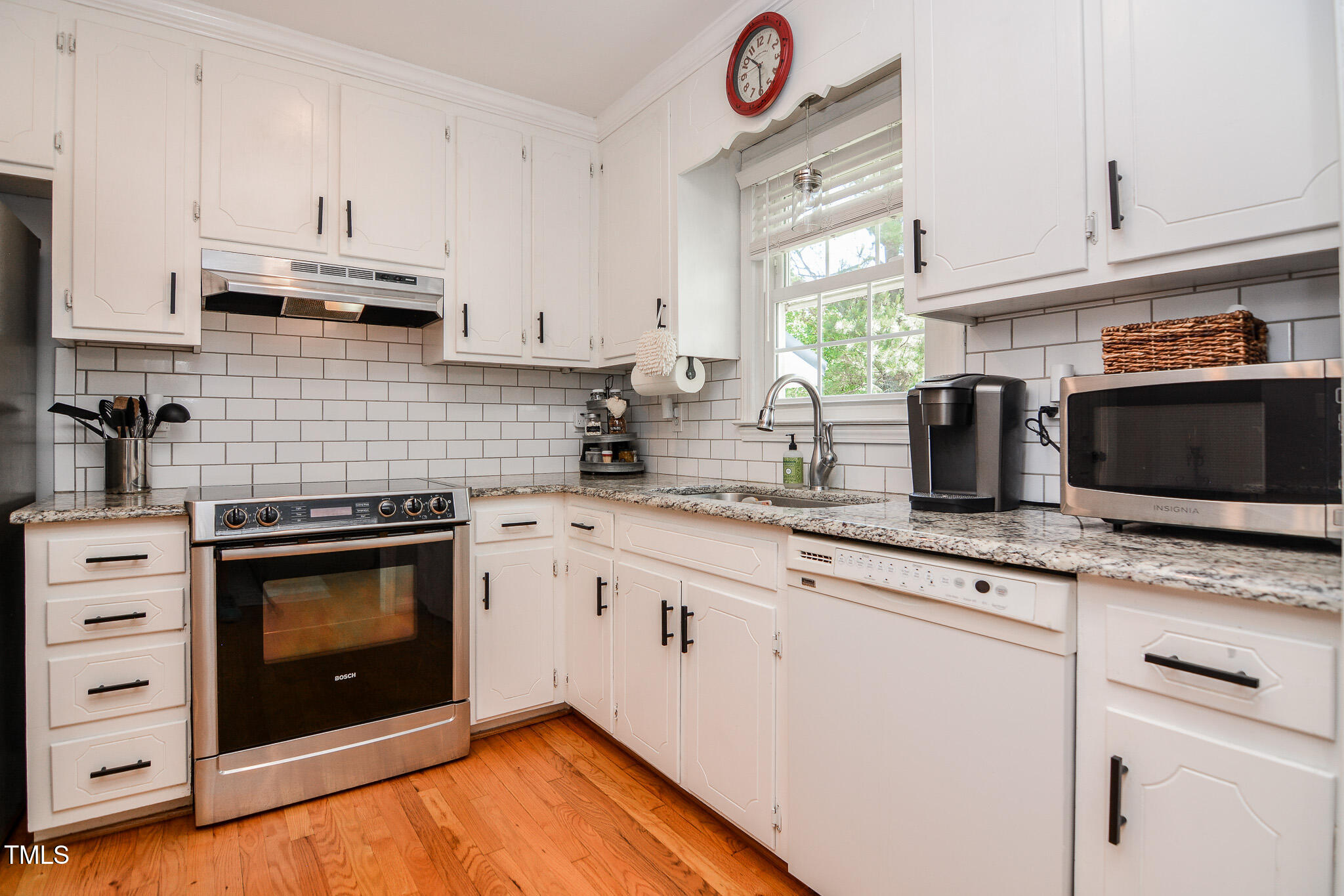 2717 Jack Road Clayton, NC 27520 - Photo 14 of 59 Kitchen with Tiled Backsplash