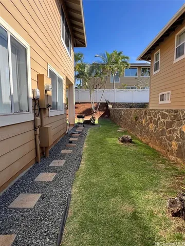 a view of a backyard with sitting area