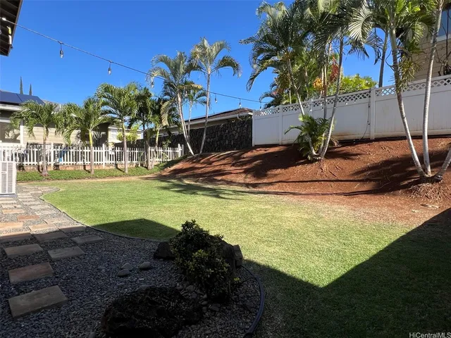a view of a swimming pool with a yard