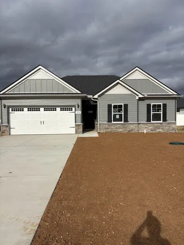 a front view of a house with large windows