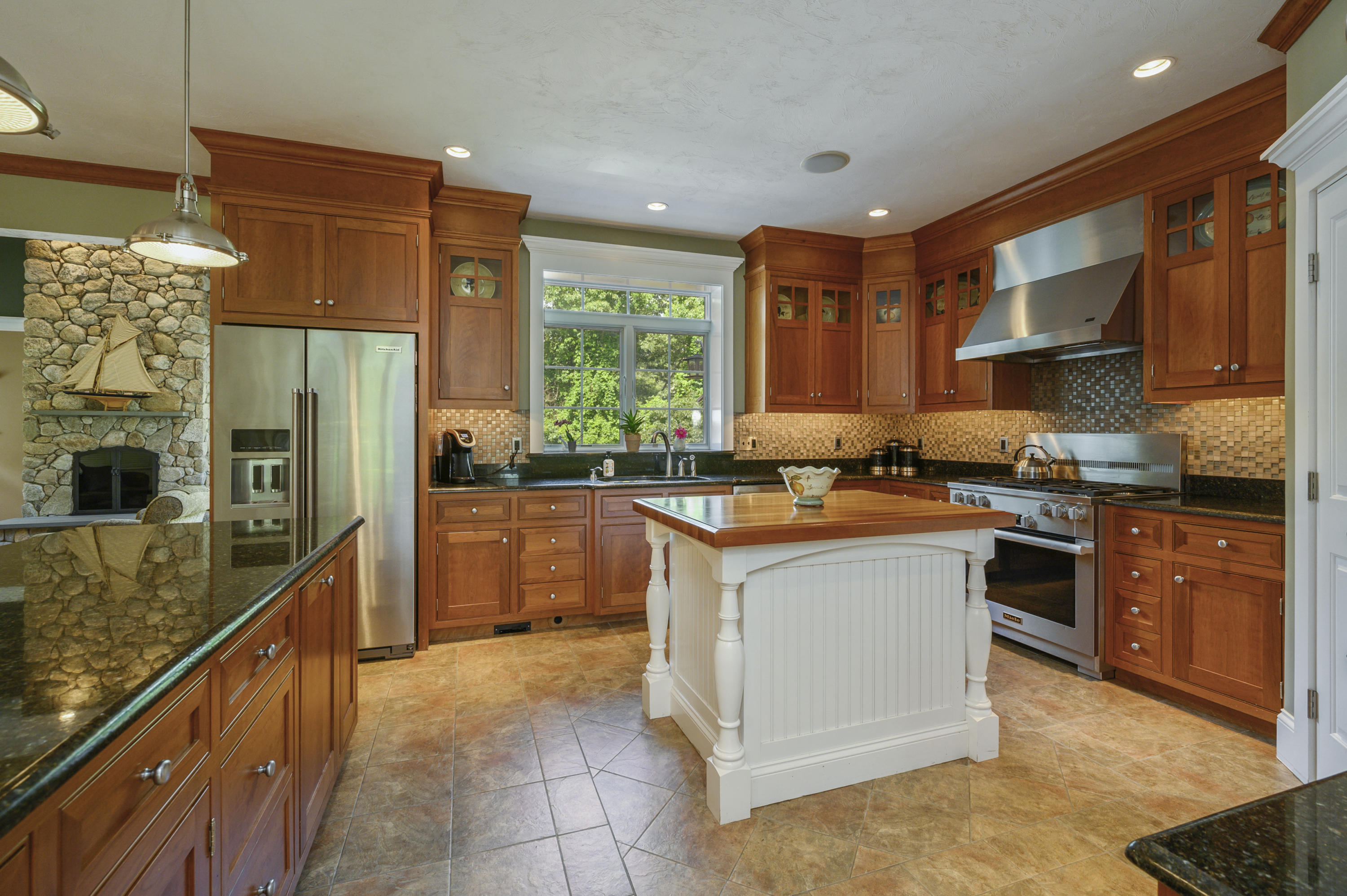 80 Crocker Road West Barnstable, MA 02668 - Photo 11 of 35 a kitchen with stainless steel appliances granite countertop a stove a sink a refrigerator and a oven