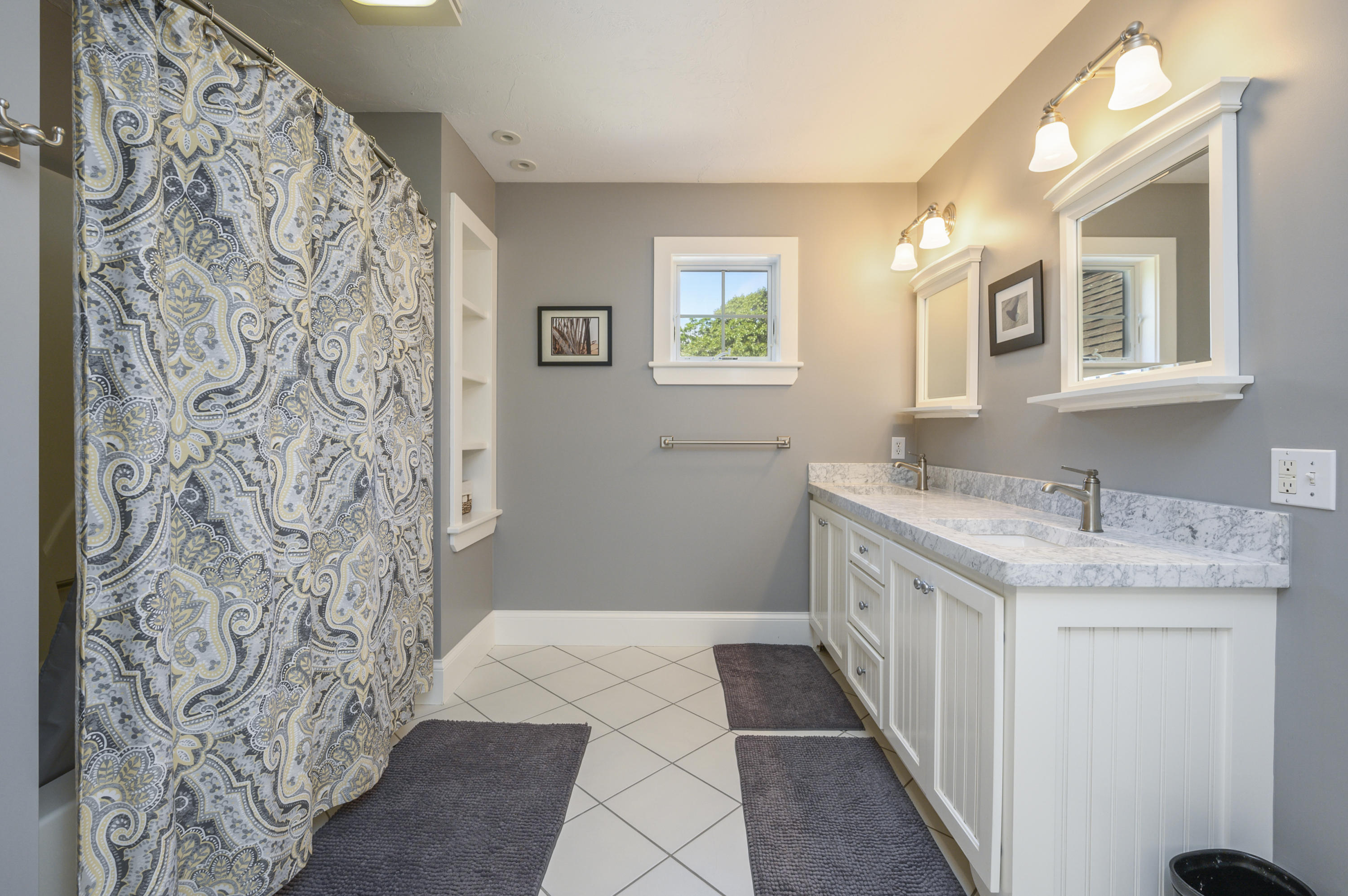 80 Crocker Road West Barnstable, MA 02668 - Photo 28 of 35 a bathroom with a granite countertop sink a mirror a vanity and a shower