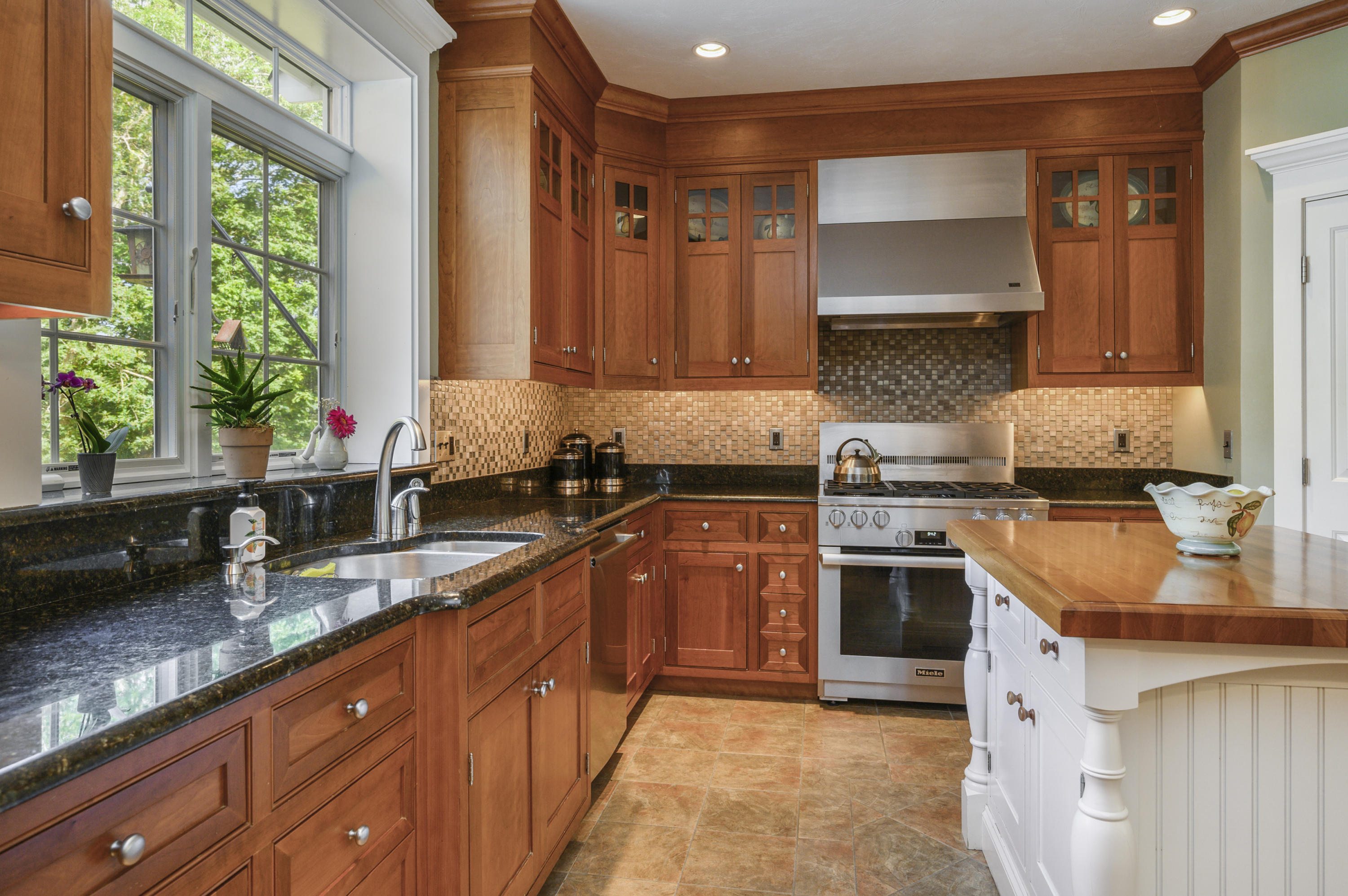 80 Crocker Road West Barnstable, MA 02668 - Photo 9 of 35 a kitchen with stainless steel appliances granite countertop a sink stove and cabinets