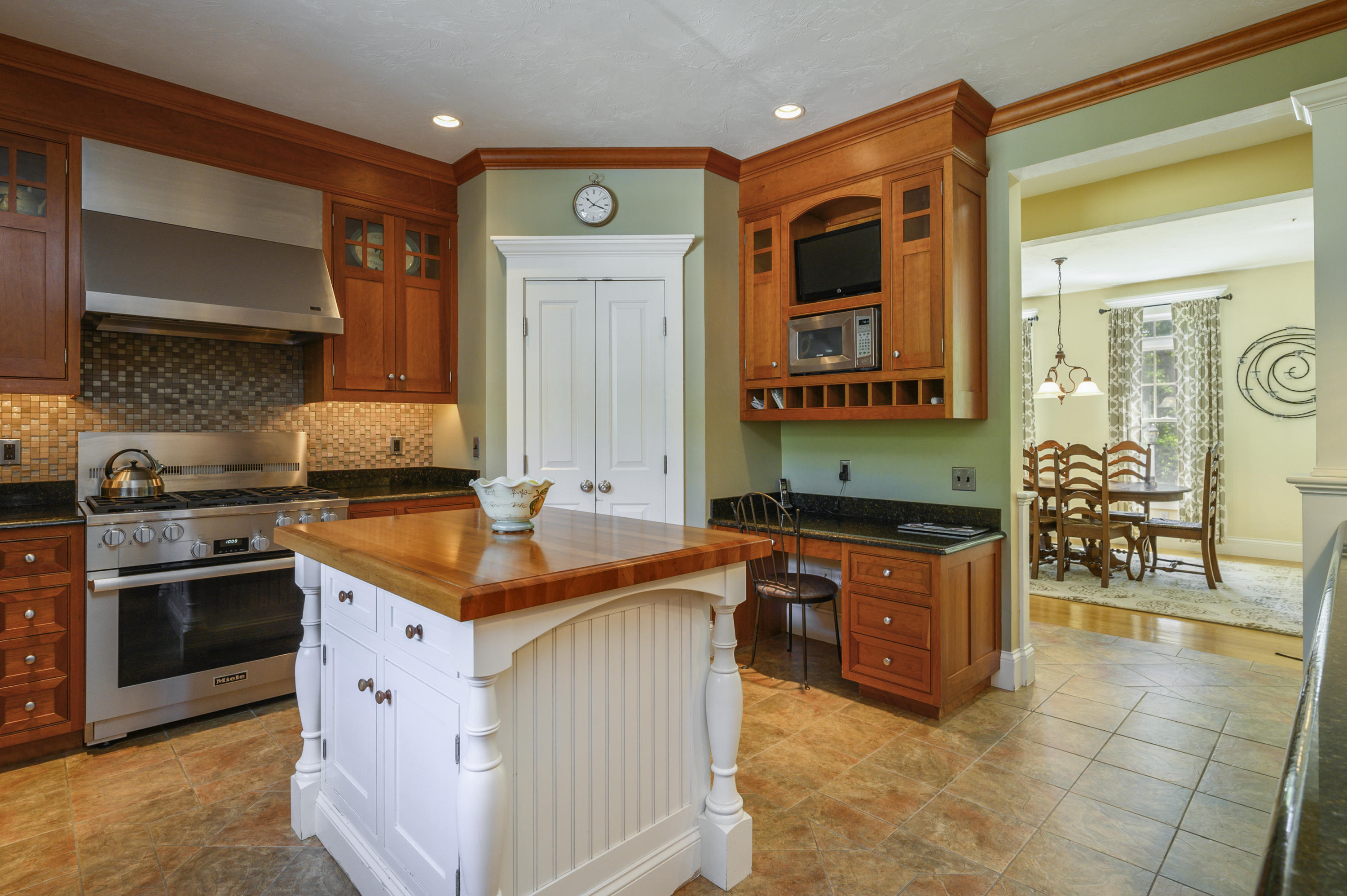 80 Crocker Road West Barnstable, MA 02668 - Photo 10 of 35 a kitchen with stainless steel appliances granite countertop a stove a sink and a refrigerator