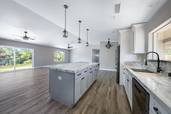 a kitchen with a stove and a sink