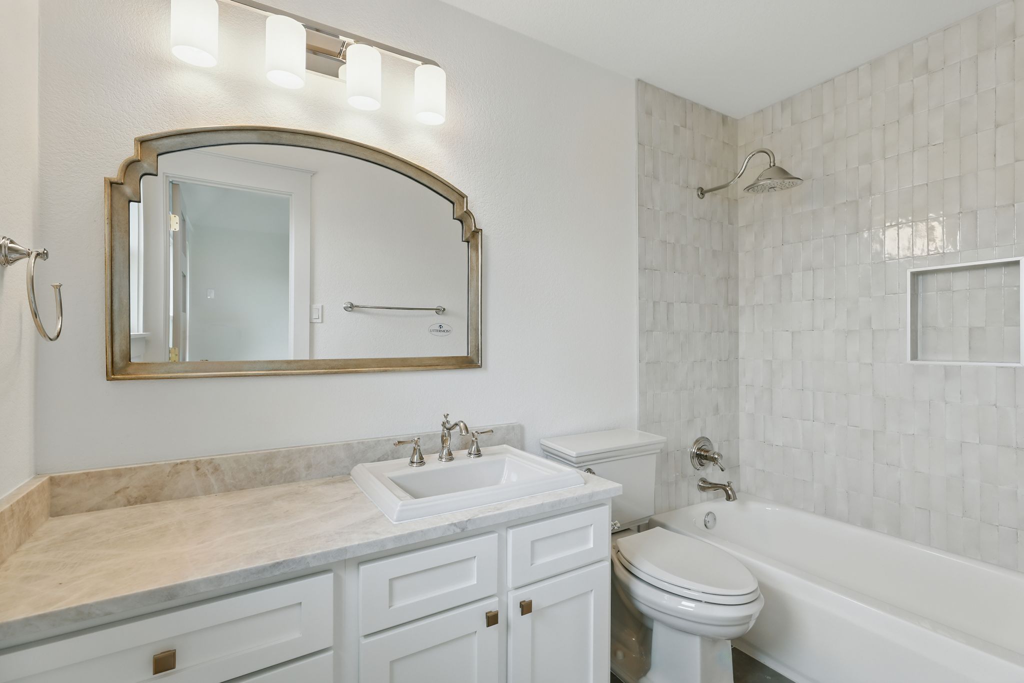 6905 Rudi Cove Austin, TX 78759 - Photo 32 of 36 a bathroom with a sink a toilet and a mirror