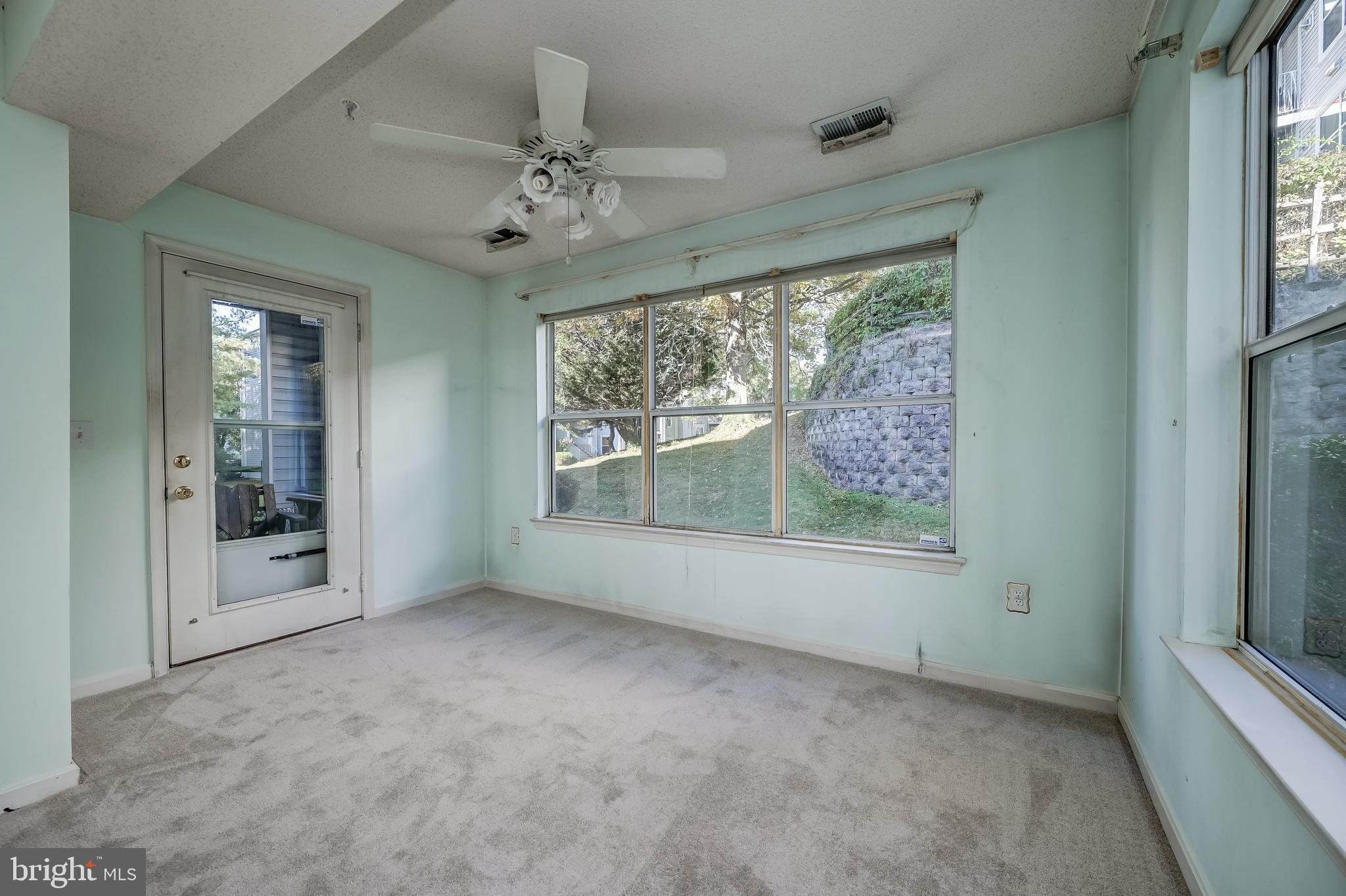 14202 Valleyfield Drive, Unit 338 Silver Spring, MD 20906 - Photo 12 of 38 an empty room that has a large window
