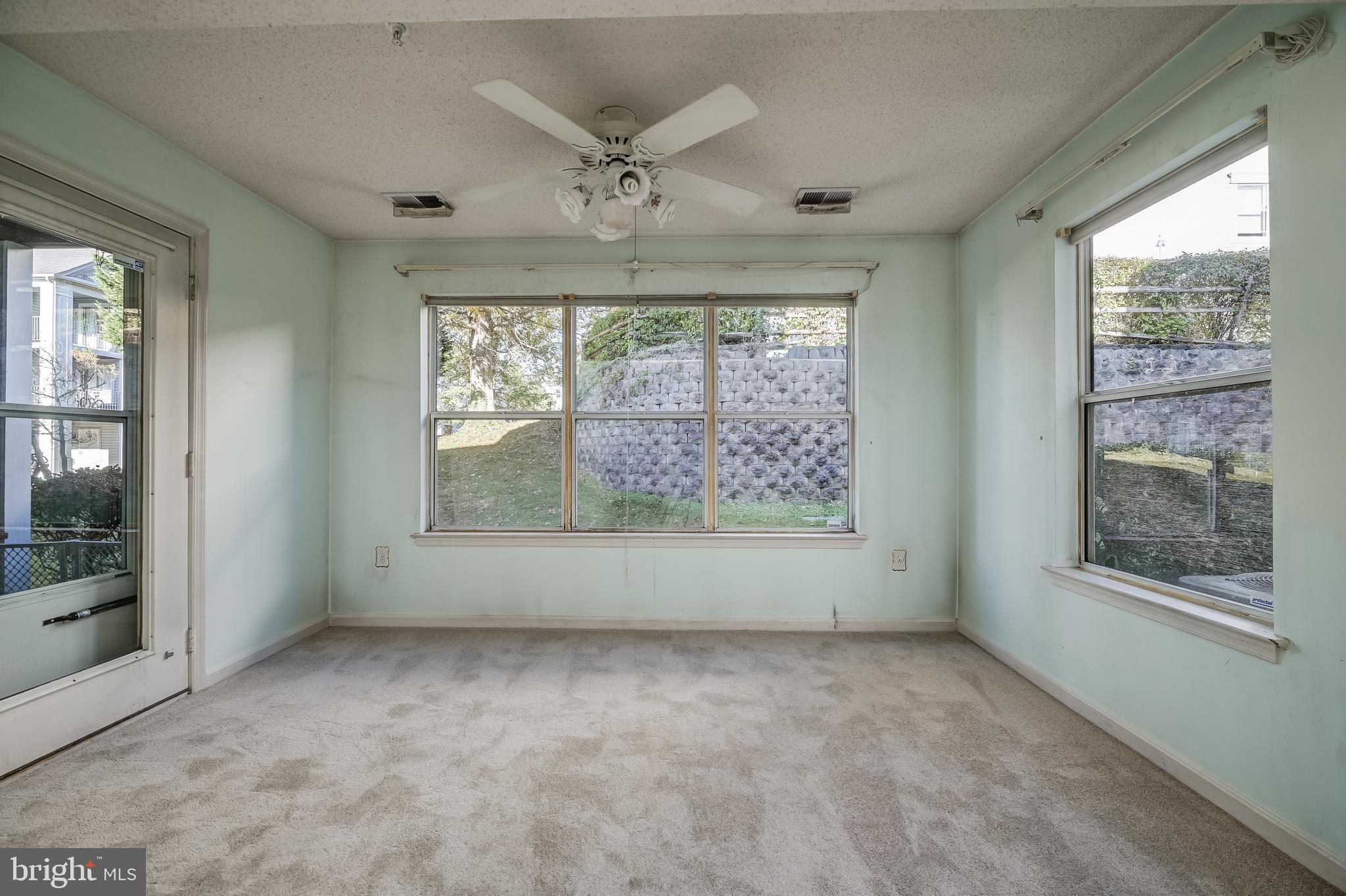 14202 Valleyfield Drive, Unit 338 Silver Spring, MD 20906 - Photo 15 of 38 an empty room with windows
